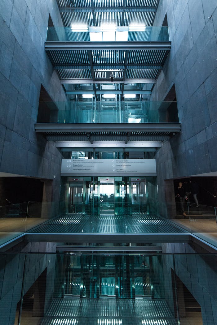 Modern glass elevator inside a stylish architectural building in Vienna.